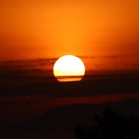 "Stunning Sunrise Captured Amid Clouds in Pokhara" Image